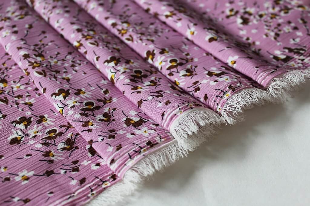 KOSHIBO YORYO CREPE 18202. DES. 25 COL.1 PINK BACKGROUND Crepe Dress Fabric
