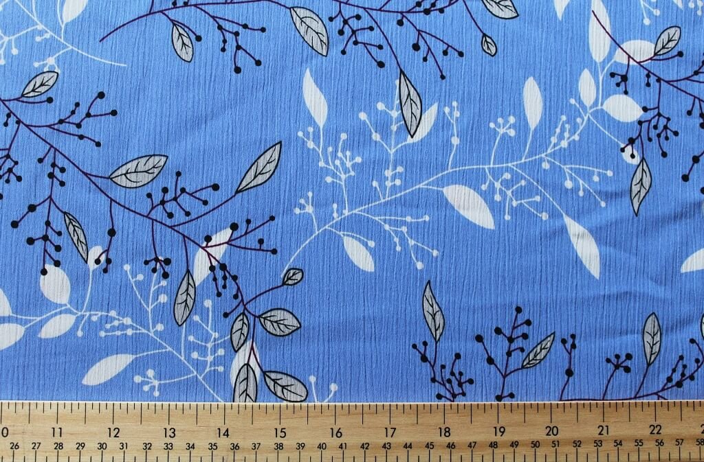 KOSHIBO YORYO CREPE 18202. DES. 76 COL.1 "LEAVES" BLUE BACKGROUND Crepe Dress Fabric