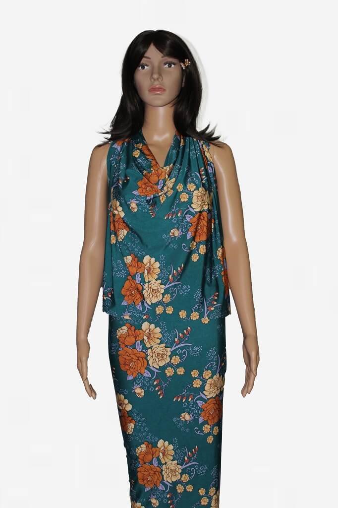 ITY KNIT JERSEY 18203. DES #4 COL4 TEAL BACKGROUND MODEL IS SHOWING A DRESS MADE FROM ITY JERSEY KNIT FABRIC FLORAL PRINT TEAL GREEN COLOR