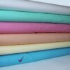 Set of 6 colored bolts of Cotton fabric
