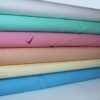 Set of 6 colored bolts of Cotton fabric