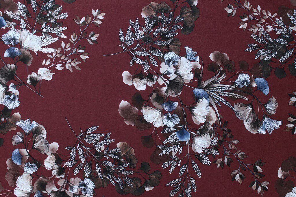 POLYESTER STRETCH DRESS FABRIC DES.5/4 MAROON BACKGROUND