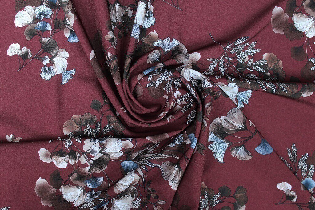 POLYESTER STRETCH DRESS FABRIC DES.5/4 MAROON BACKGROUND Polyester stretch dress woven fabric