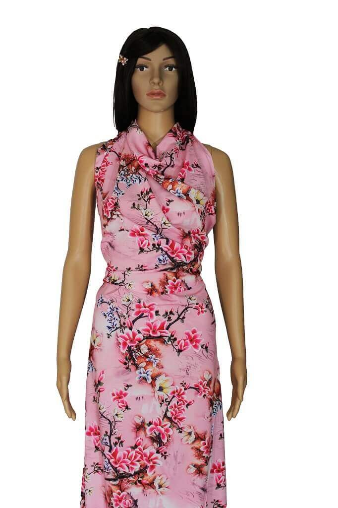 POLYESTER STRETCH DRESS FABRIC DES.8/1 PINK BACKGROUND MANNEQUIN IS SHOWING A DRESS MADE FROM POLYESTER FABRIC FLORAL PINK BACKGROUND