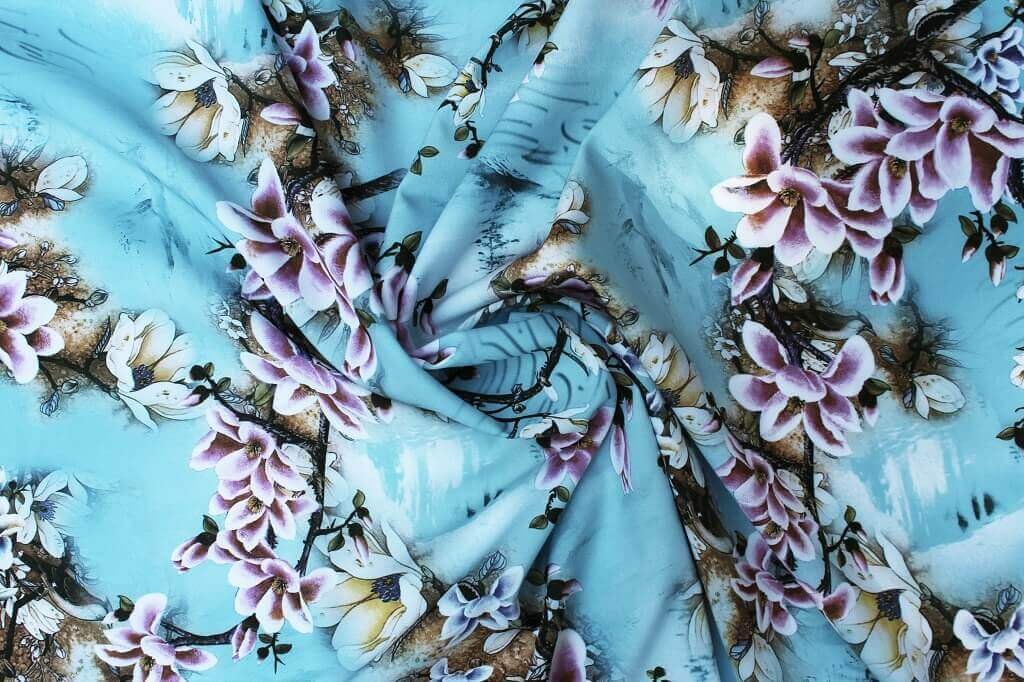 POLYESTER STRETCH DRESS FABRIC DES.8/2 SKY BLUE BACKGROUND Polyester stretch dress fabric floral blue